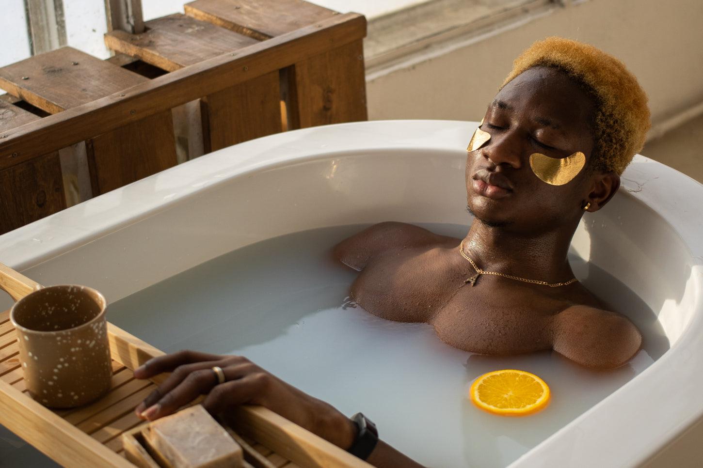 Single plant in a brown and white pot sitting on windowsill against white curtains in the morning.