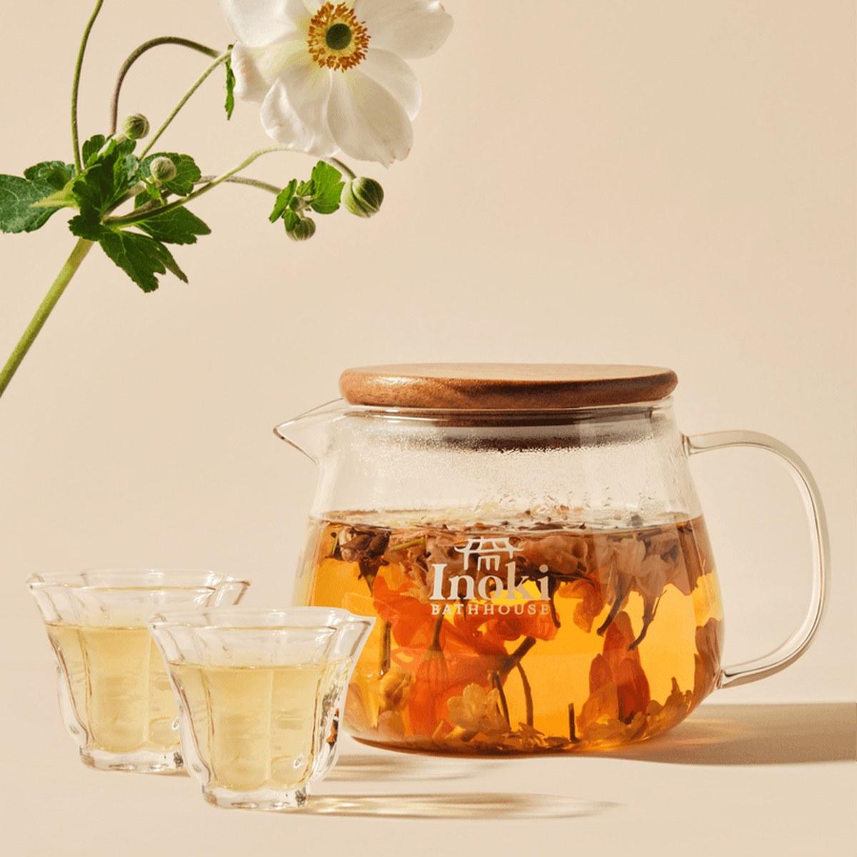 Flower tea steeping in a glass teapot