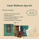 What's included in the Oasis Wellness Spa Set: large signature soak, glass jar, four cotton steeping bags, soft massage dry brush, plus guided breathwork and music